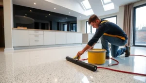 Experienced liquid screeding Birmingham technician laying smooth floor screed in a contemporary